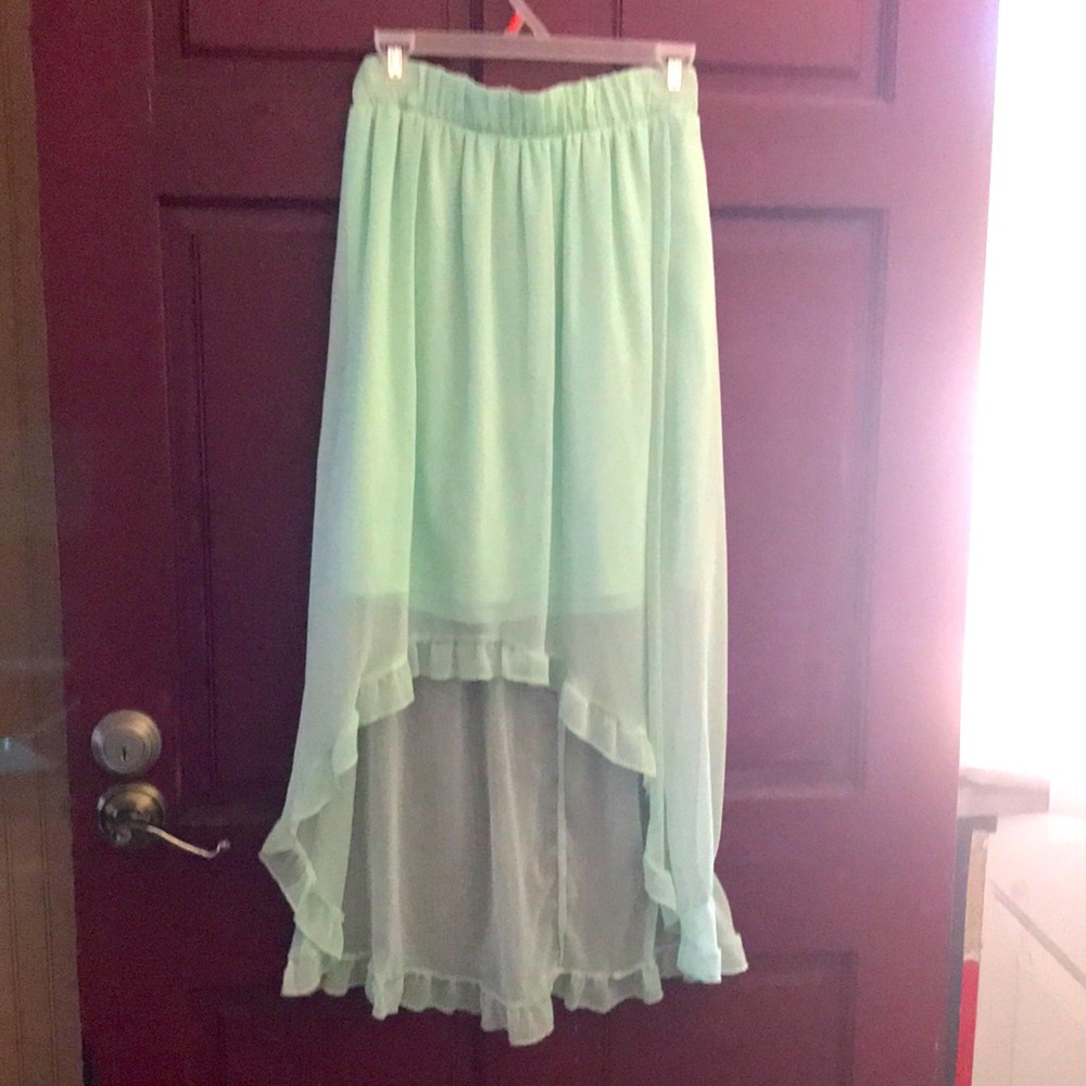 Soft light mint green skirt.